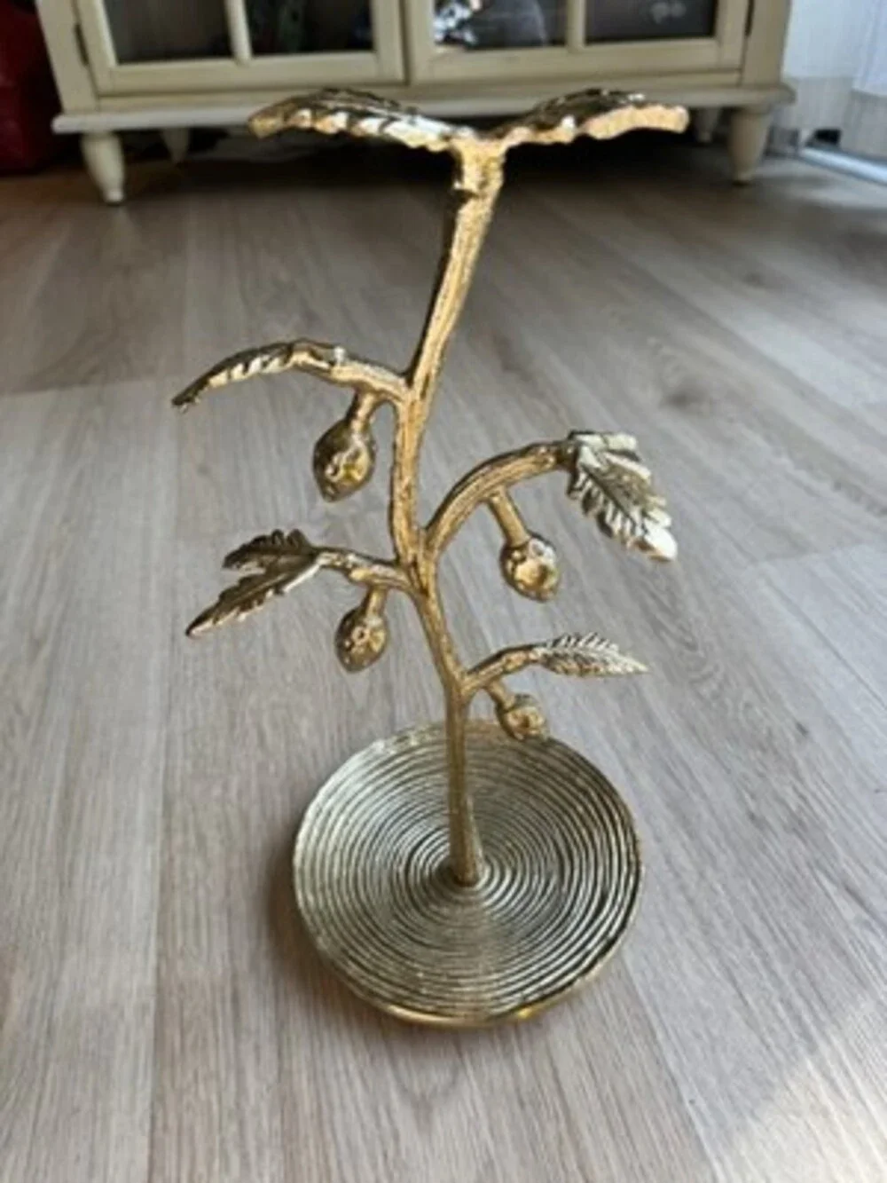 Gold painted jewelry stand metal with a strawberry design, elegant jewelry stand